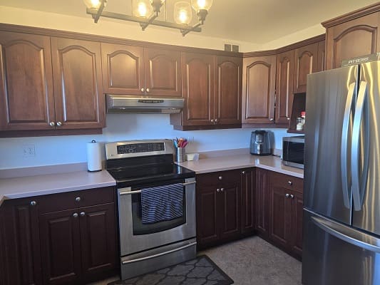 Modern kitchen with dark wood cabinets.