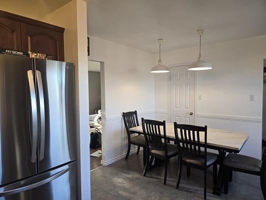 Kitchen with dining table and chairs.