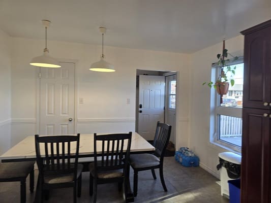 Dining room with table and chairs.