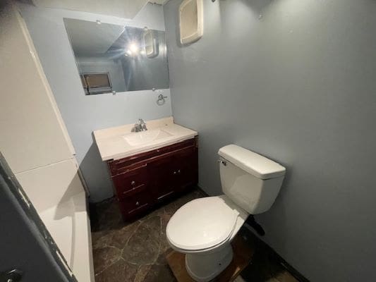 Small bathroom with sink and toilet.