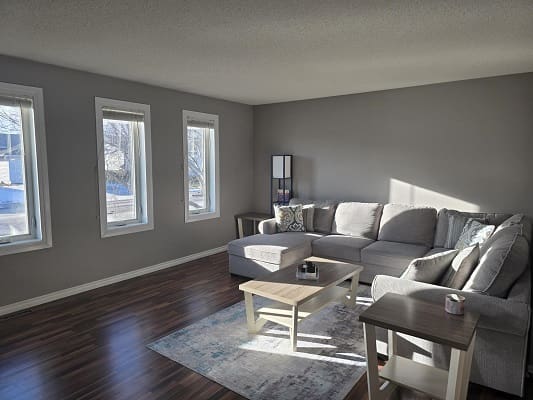 Bright living room with gray sectional sofa.