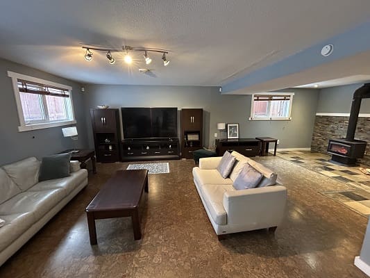 Spacious living room with modern furniture.