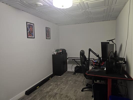 Home office with computer and keyboard setup.