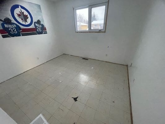 Empty room with hockey-themed wall art.