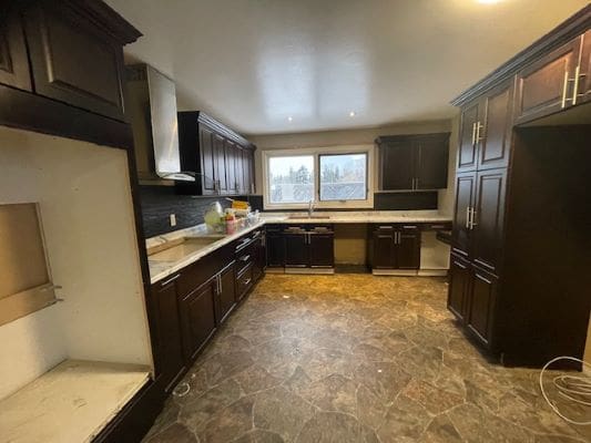 Spacious kitchen with dark wood cabinets.