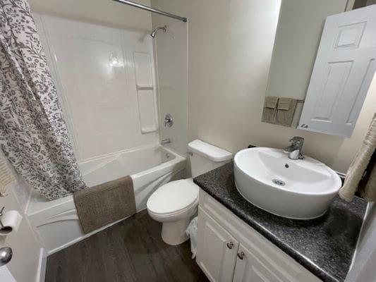 Modern bathroom with sink and bathtub.