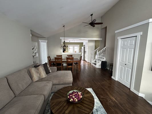 Open-plan living room with wooden flooring.