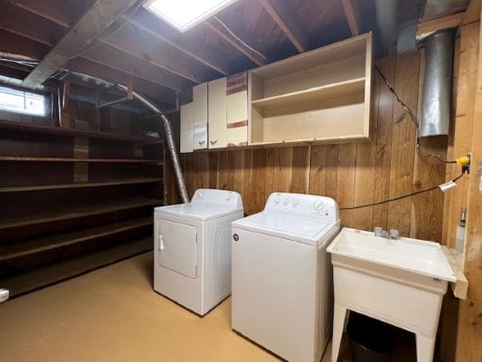 Basement laundry room with washer and dryer.