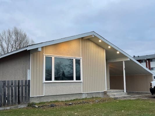 Single-story house with angled roof design.