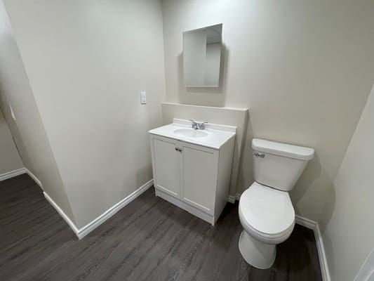 Small bathroom with sink and toilet.