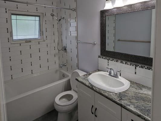 Modern bathroom with sink and bathtub.