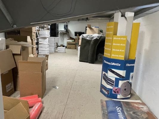 Storage room with boxes and equipment.