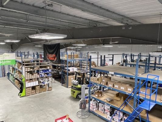 Warehouse interior with shelves and boxes.