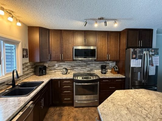 Modern kitchen with dark wood cabinets.
