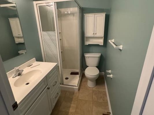 Small bathroom with shower and toilet.