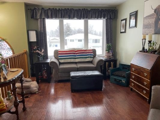 Cozy living room with large window.