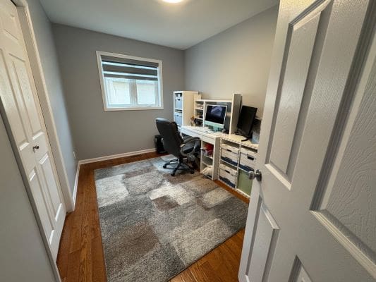 Small home office with desk and chair.