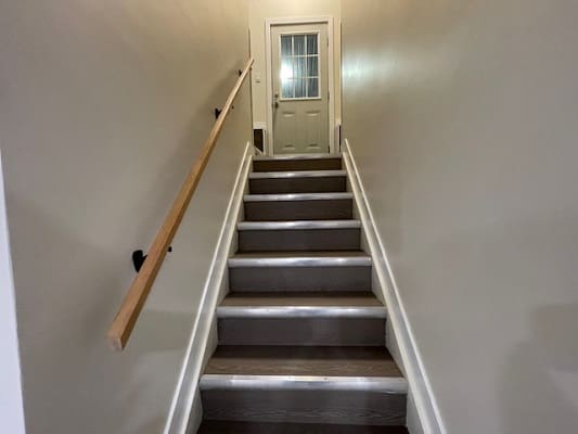 Stairway with door at the top.
