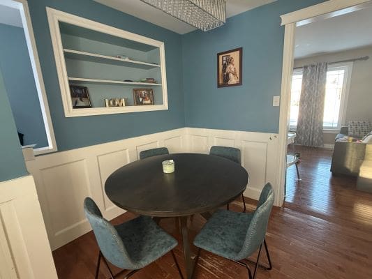 Dining room with round table and chairs.