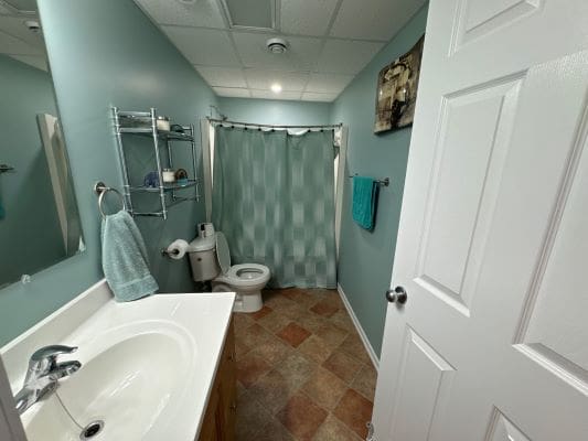 Small bathroom with shower and toilet.