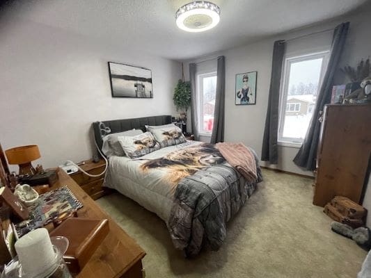 Cozy bedroom with double bed and decorations.