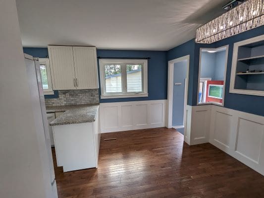 Modern kitchen with blue and white decor.