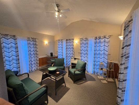 Cozy living room with patterned curtains.