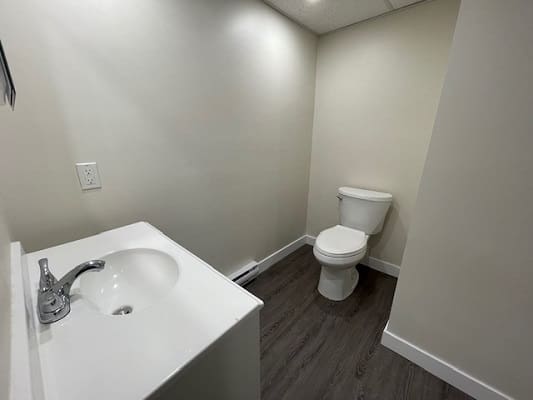 Small bathroom with sink and toilet.