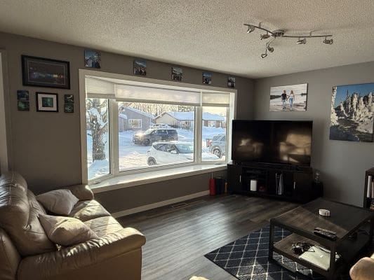 Cozy living room with large window view.