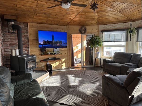 Cozy living room with wood paneling.