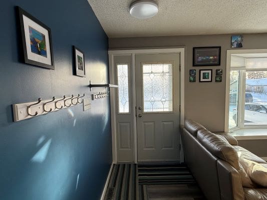 Living room entrance with blue accent wall.