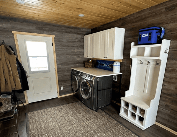 Rustic laundry room with washer and dryer.