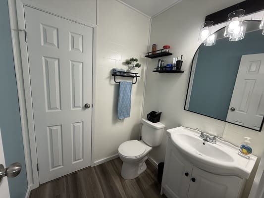 Modern bathroom with sink and toilet.