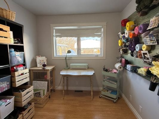 Craft room with yarn and supplies organized.