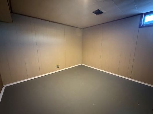 Empty room with beige walls and ceiling.