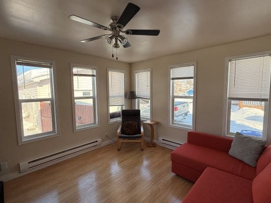 Bright living room with red sectional sofa.