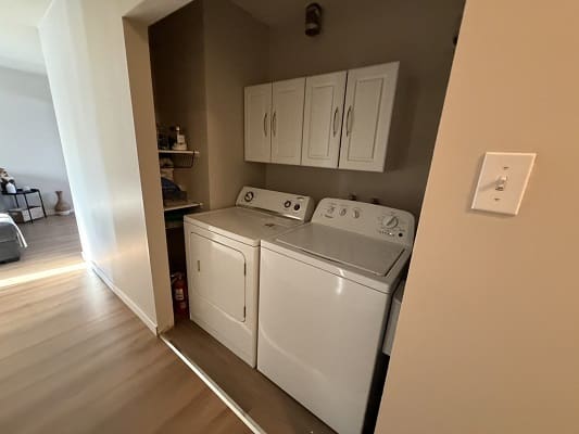Laundry area with washer and dryer units.