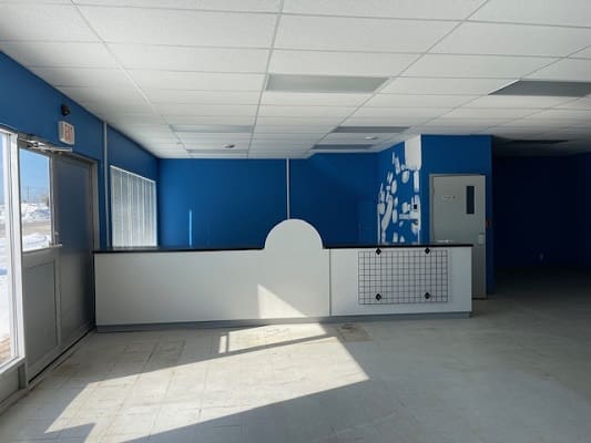 Empty room with blue and white walls.
