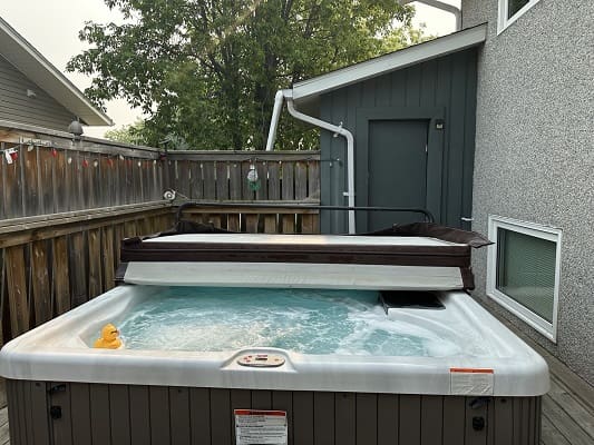 Outdoor hot tub with rubber ducky.