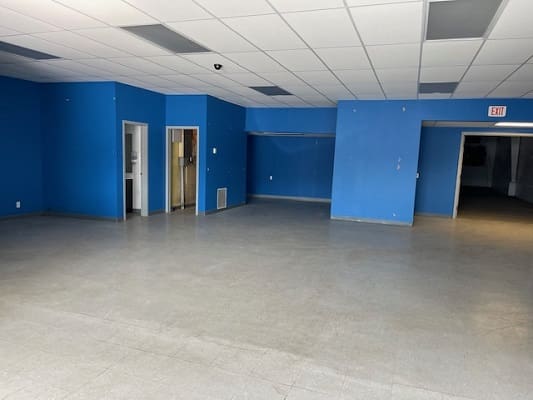 Empty room with blue walls and ceiling.