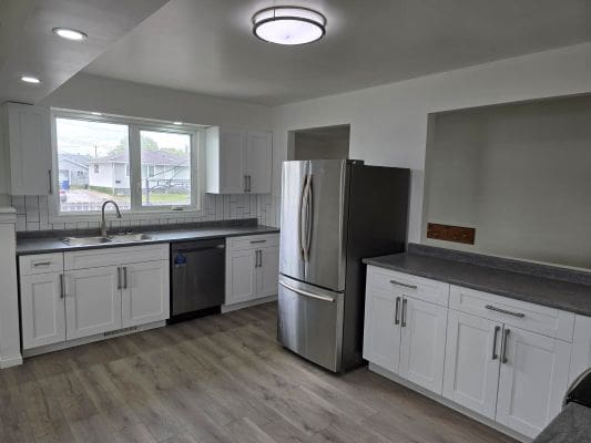 Modern kitchen with stainless steel appliances.