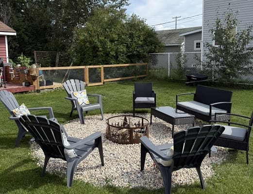 Outdoor seating area with fire pit.