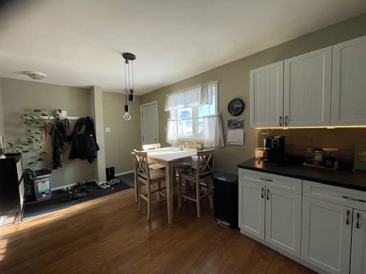 Kitchen and dining area with natural light.