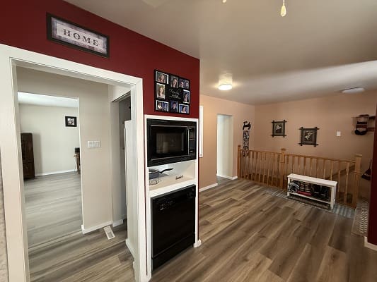 Open-concept living area with wood flooring.