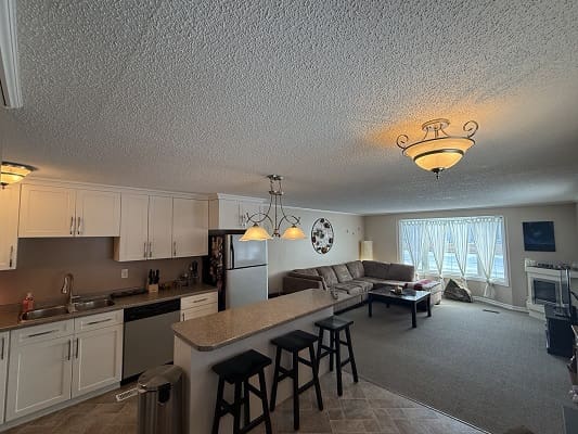 Open-plan kitchen and living room area.