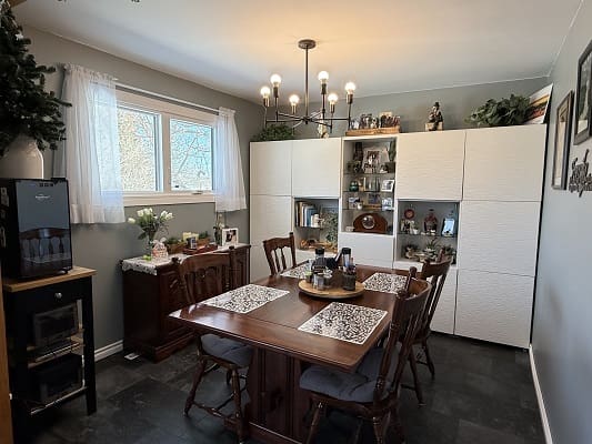 Cozy dining room with elegant wooden table.