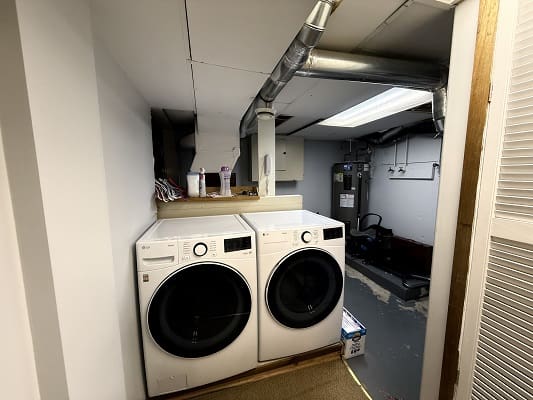 Basement laundry room with washer and dryer.