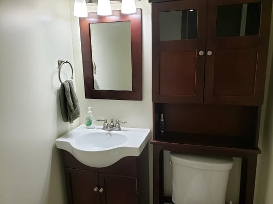 Bathroom with sink, mirror, and cabinet.