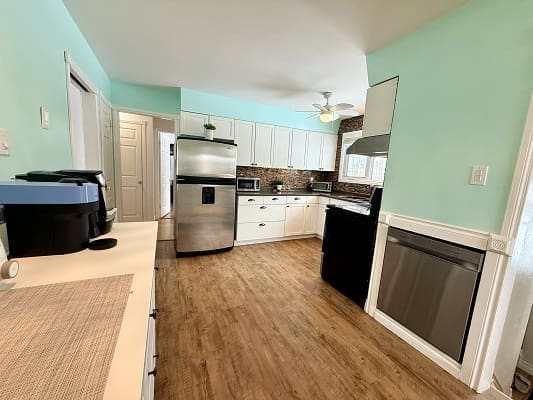 Modern kitchen with stainless steel appliances.