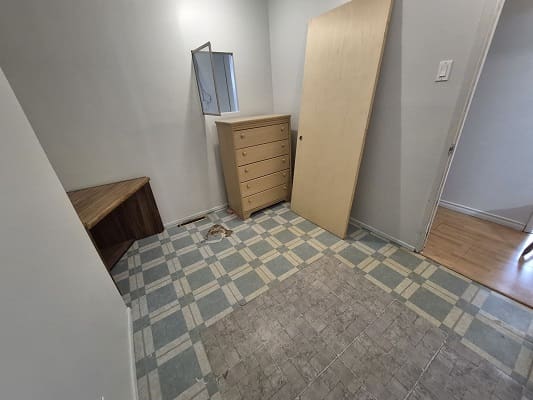 Small room with furniture and tiled floor.